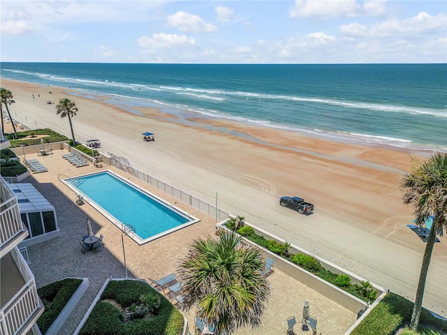 drone / aerial view with a water view and a view of the beach