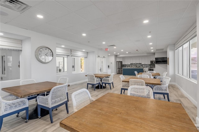 dining area with light hardwood / wood-style floors