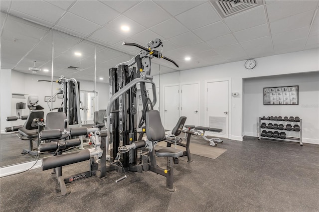 exercise room featuring a paneled ceiling