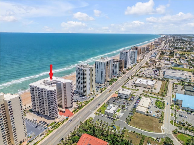 aerial view featuring a water view and a view of the beach