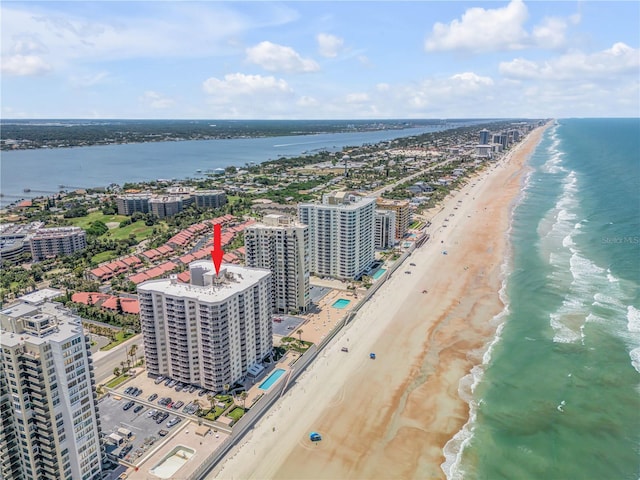 aerial view featuring a water view and a beach view