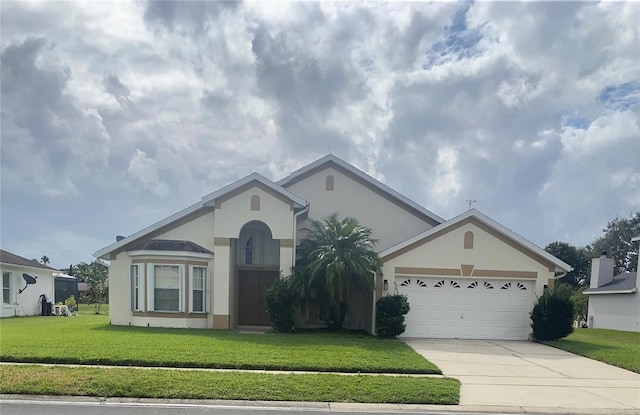 single story home featuring a front yard and a garage