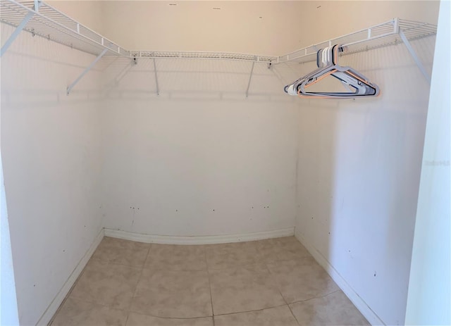 spacious closet with tile patterned flooring