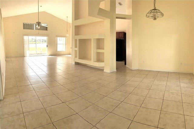 2688 Hawthorne Ln, Kissimmee, FL 34743 - unfurnished living room with light tile patterned floors, high vaulted ceiling, ceiling fan, built in features, and baseboards