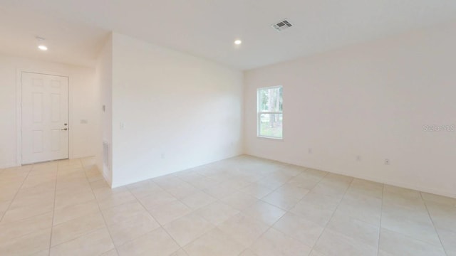 spare room featuring light tile patterned floors