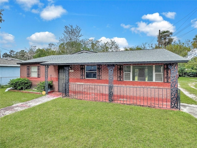 ranch-style home with a front lawn