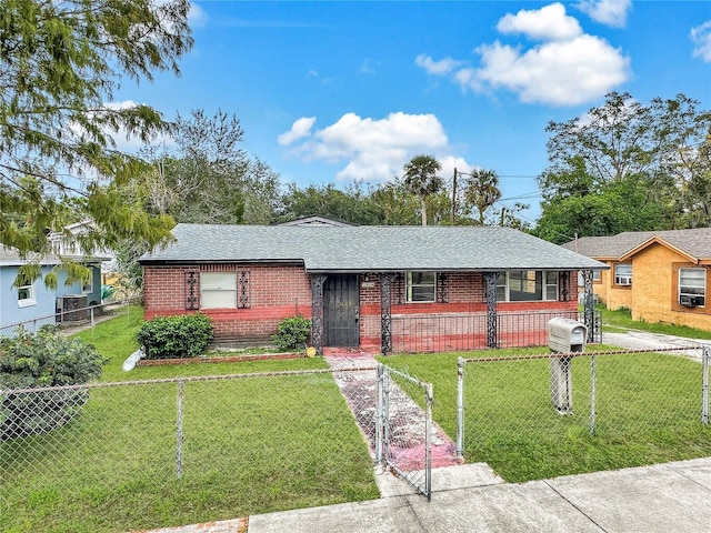 single story home with a gate, a fenced front yard, a front yard, and brick siding
