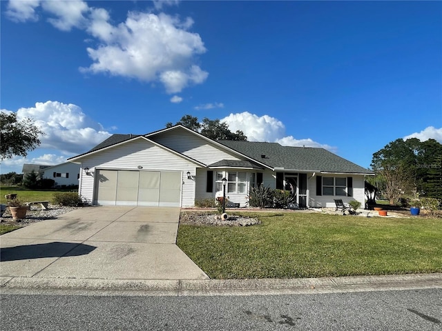 single story home featuring a front yard and a garage