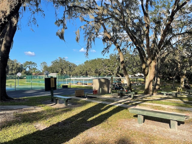 view of community featuring fence