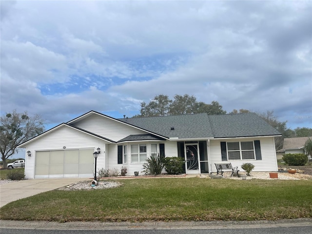 ranch-style home with a front yard, concrete driveway, roof with shingles, and an attached garage