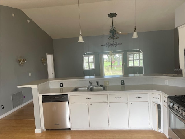 kitchen with visible vents, white cabinets, appliances with stainless steel finishes, pendant lighting, and a sink