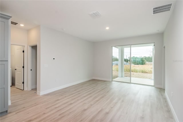 spare room with light wood-type flooring