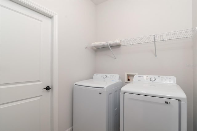 laundry room with independent washer and dryer