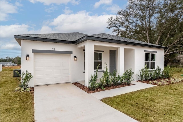 view of front of house with a front lawn and a garage