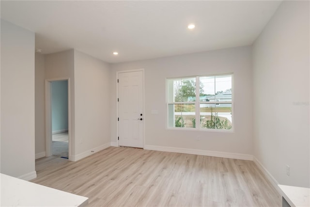 unfurnished room featuring light wood-type flooring