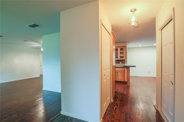 hallway featuring dark wood-type flooring