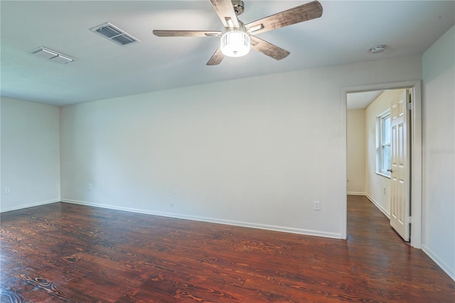 spare room featuring dark hardwood / wood-style floors and ceiling fan