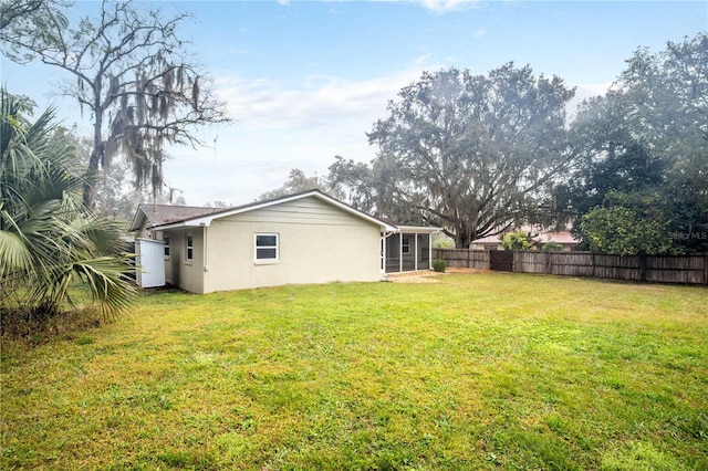 view of yard featuring a sunroom