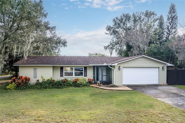 ranch-style home featuring a front yard and a garage