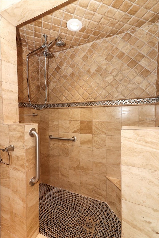 bathroom with a tile shower