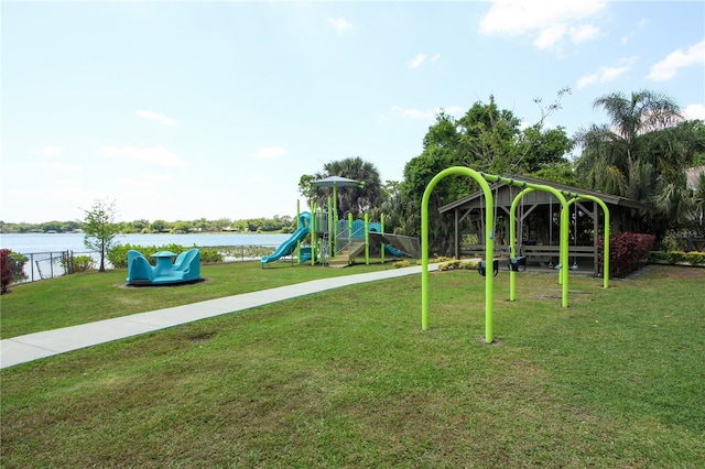 view of jungle gym with a water view and a yard