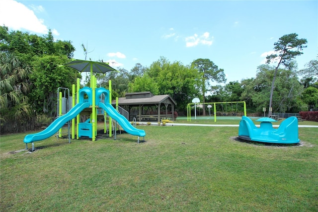 view of jungle gym featuring a lawn