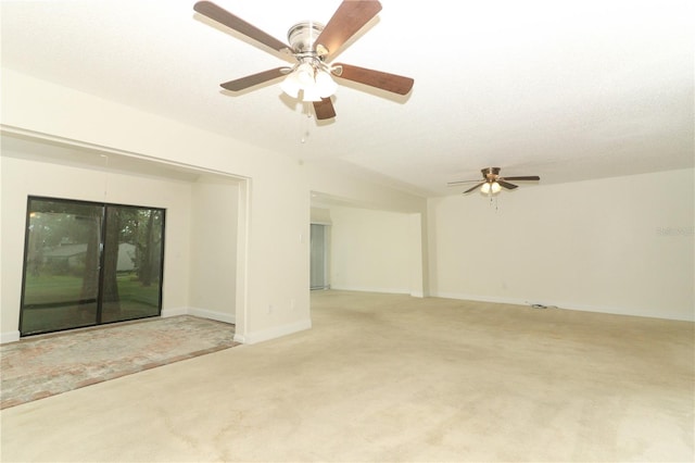 spare room featuring carpet flooring and ceiling fan