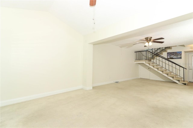 unfurnished living room with carpet flooring, ceiling fan, and lofted ceiling