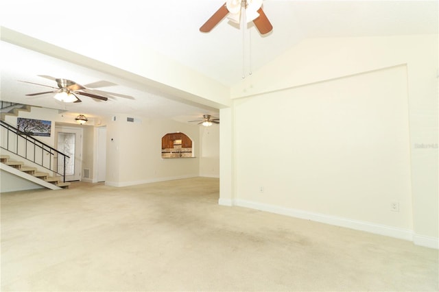 unfurnished living room with light colored carpet and lofted ceiling