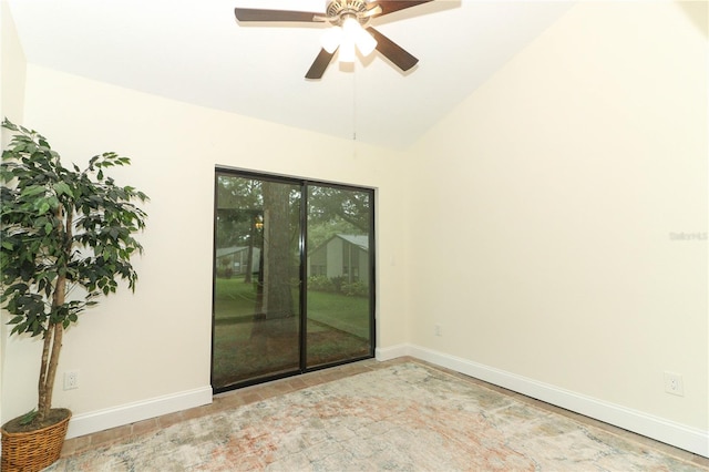 empty room featuring ceiling fan and vaulted ceiling