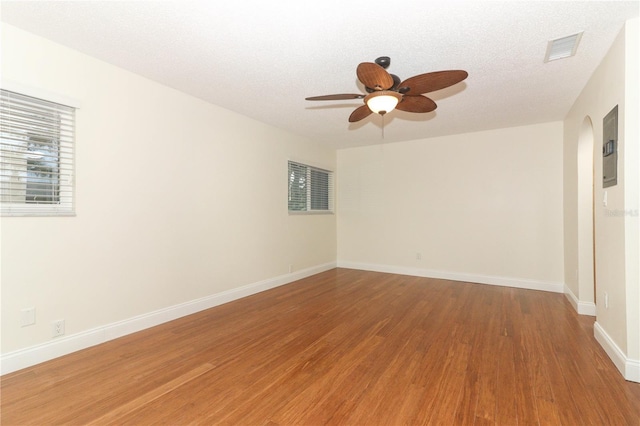 spare room featuring hardwood / wood-style floors, a textured ceiling, and ceiling fan