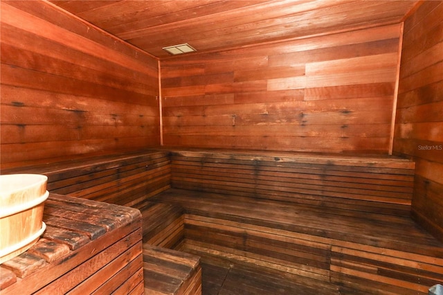 view of sauna / steam room with wood walls and wood ceiling