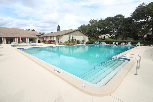 view of swimming pool with a patio area