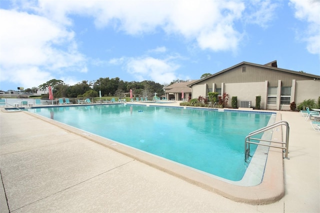 view of swimming pool featuring cooling unit