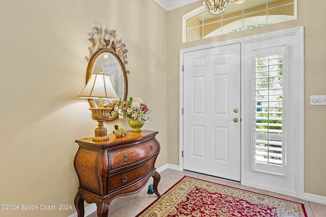 tiled entrance foyer with ornamental molding