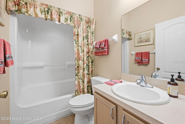 full bathroom featuring toilet, shower / bath combo, vanity, and tile patterned flooring