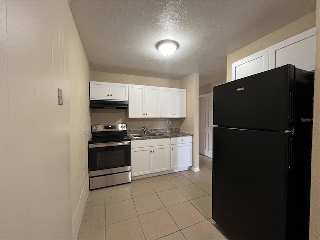 kitchen with white cabinetry, black fridge, a textured ceiling, and stainless steel range with electric cooktop