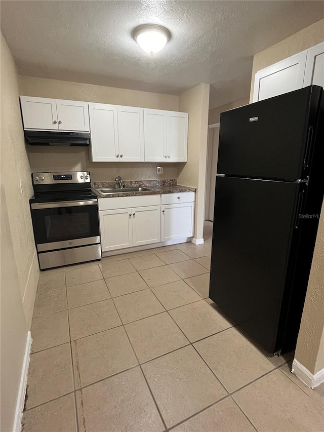 kitchen with black fridge, sink, electric range, and light tile patterned floors