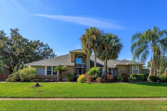 ranch-style house with a front lawn