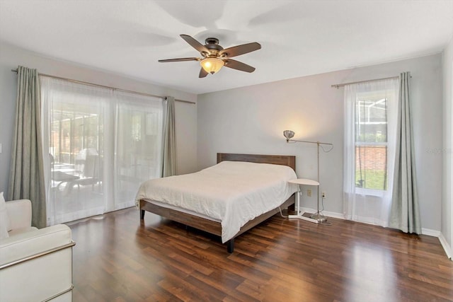 bedroom with dark wood-type flooring and ceiling fan