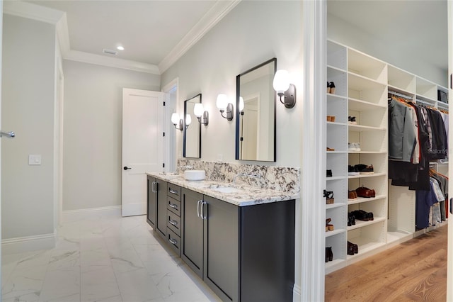 bathroom featuring vanity and ornamental molding