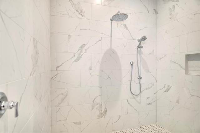 bathroom with tiled shower