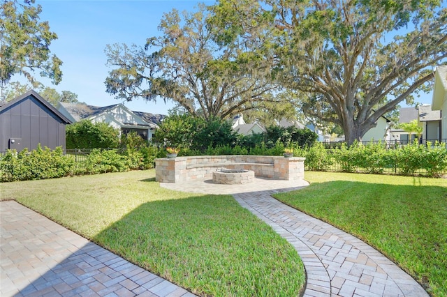 view of yard with a fire pit