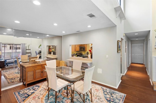 dining area with dark wood-type flooring