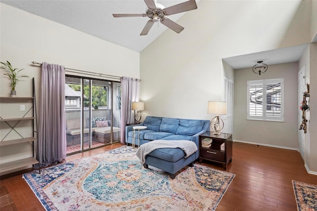 living room with dark wood-type flooring, ceiling fan, a textured ceiling, and plenty of natural light