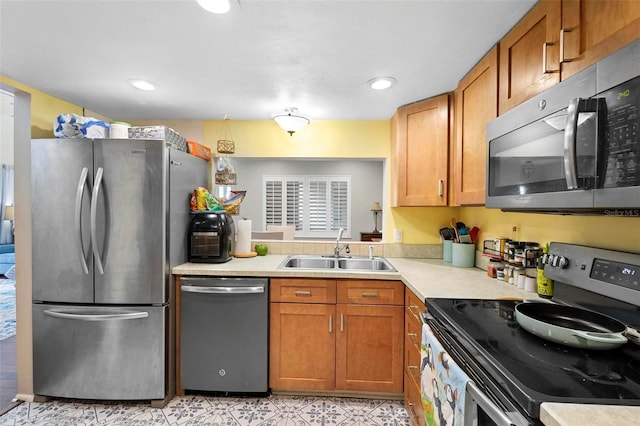 kitchen featuring appliances with stainless steel finishes and sink