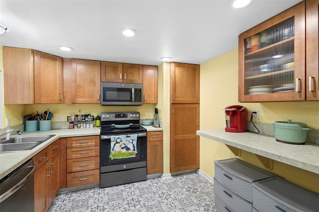 kitchen with sink and appliances with stainless steel finishes