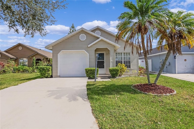 view of front of house with an attached garage, concrete driveway, and a front yard