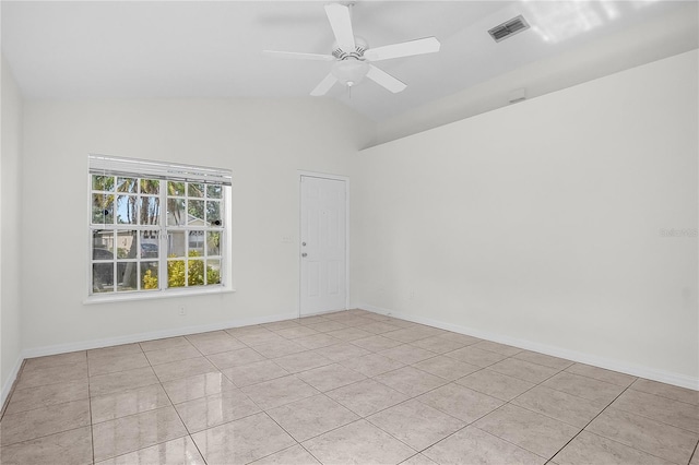 spare room featuring light tile patterned flooring, ceiling fan, and vaulted ceiling