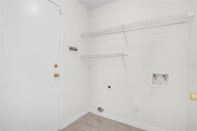 laundry room featuring baseboards, gas dryer hookup, laundry area, electric dryer hookup, and washer hookup